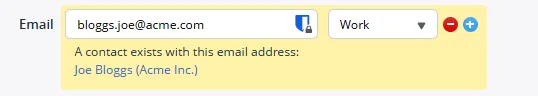 An email field on a new OnePageCRM contact with a yellow warning under it reading that a contact already exists with this email address, and a link to that contact